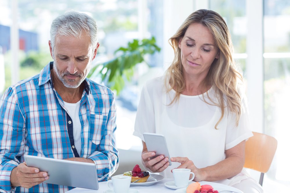 Retired couple discussing financial obligations with a lawyer.